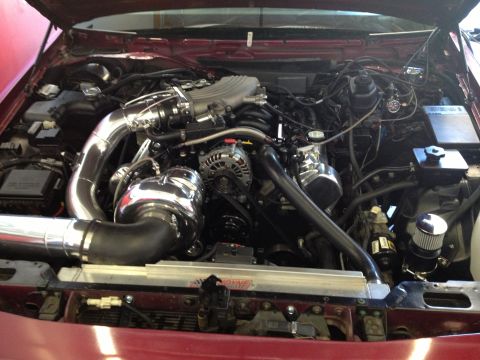 1992 Ford Crown Victoria - Engine bay with a custom turbocharger setup and aftermarket intercooler.