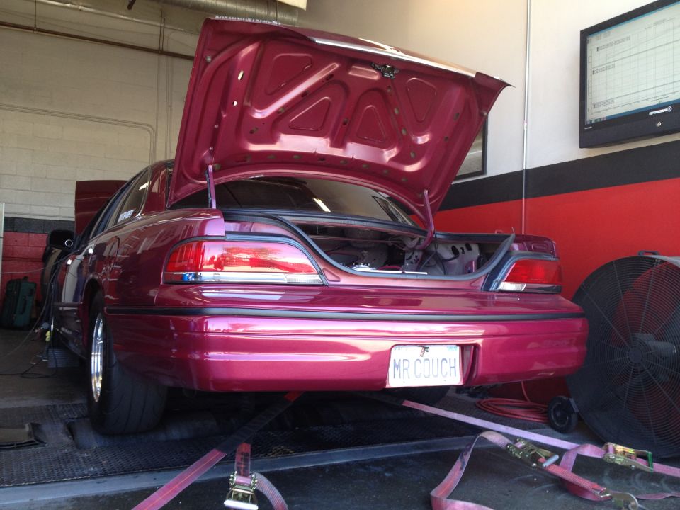 1992 Ford Crown Victoria on a dynamometer with trunk open, license plate reads MR COUCH