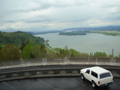 1990 Ford Bronco - White 1990 Ford Bronco parked at a scenic overlook with a river and hills in the background.