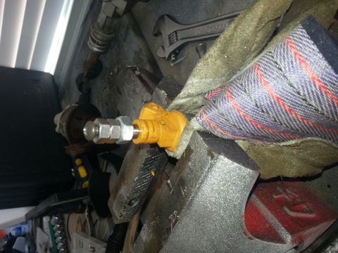 1994 Ford Bronco - Automotive part secured in a vise, ready for work.