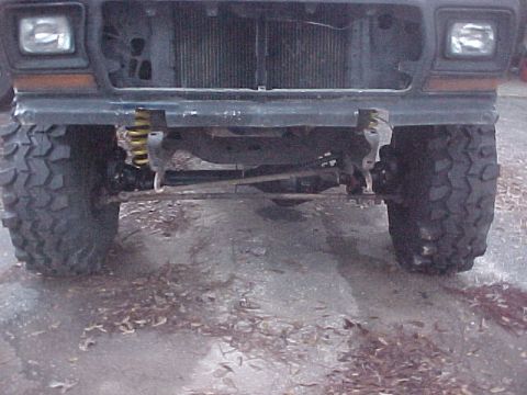 1979 Ford Bronco - Front view of a lifted truck, showing large tires and suspension modifications.