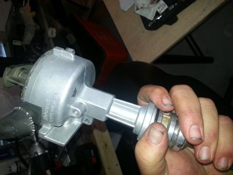 1994 Ford Bronco - Motorcraft distributor part held in hand, with visible part numbers.