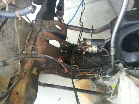 1994 Ford Bronco - Close-up view of a starter motor and associated frame components.