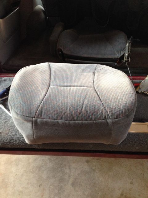 1995 Ford Bronco - After removing the seat and separating the bottom from the back, I was able to move the new cushion into position for the OE seat cover to…