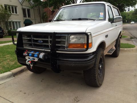 1996 Ford Bronco - Front view of a 1996 Ford Bronco equipped with a winch and brush guard.