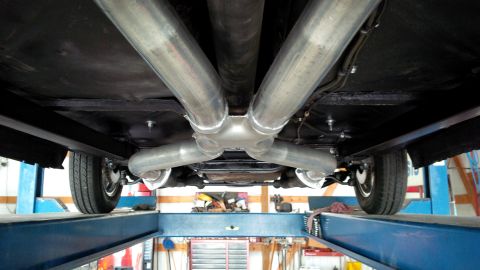1963 Chevrolet Nova - Underside view of a vehicle's dual exhaust system, showing the pipes and mufflers.