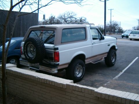 1996 Ford Bronco - This 1996 Ford Bronco is shown from the rear 3/4 angle, a spare tire mounted on the tailgate.