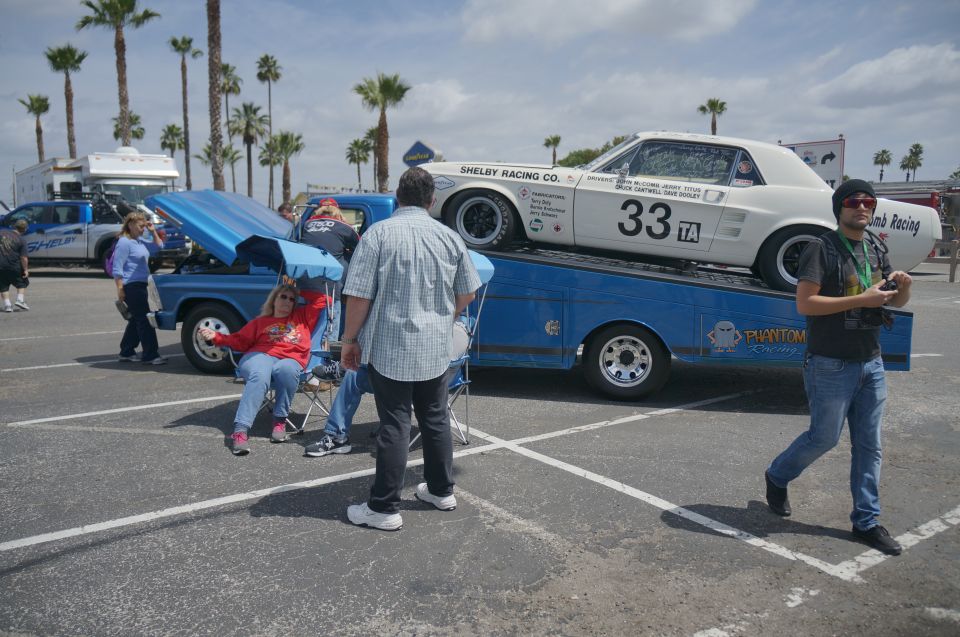 White 1967 Ford Mustang race car with number 33 TA on a blue car carrier, side view