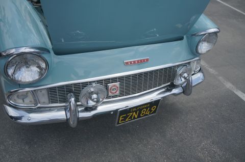 1995 Ford Taurus - A light blue 1955 Ford Anglia is shown from the front, a prominent grille and chrome accents.