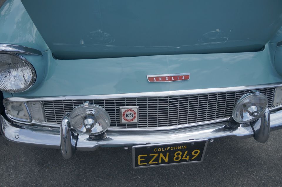 Blue car front with Anglia badge and 105E emblem