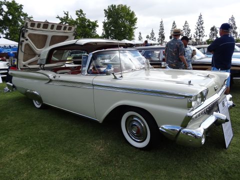 1994 Ford Bronco - A classic 1959 Ford Fairlane 500 Skyliner convertible is displayed with its roof mechanism open.