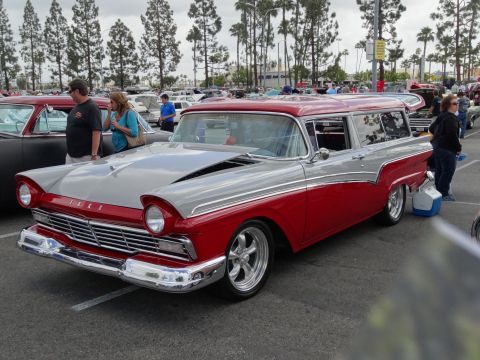 1994 Ford Bronco - This two-tone station wagon, likely a 1957 model, is displayed at an outdoor car show.