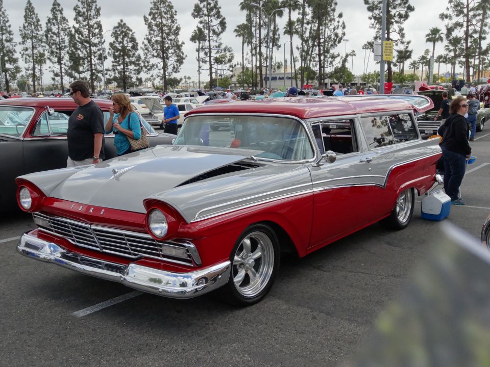 Red and silver two-tone 1957 station wagon with custom wheels