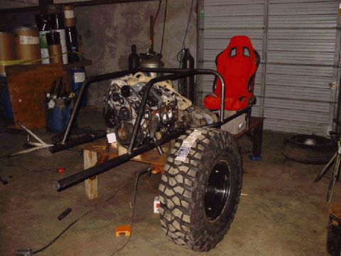 1994 Ford Bronco - A custom-built vehicle chassis is in progress, an engine and a single racing seat.
