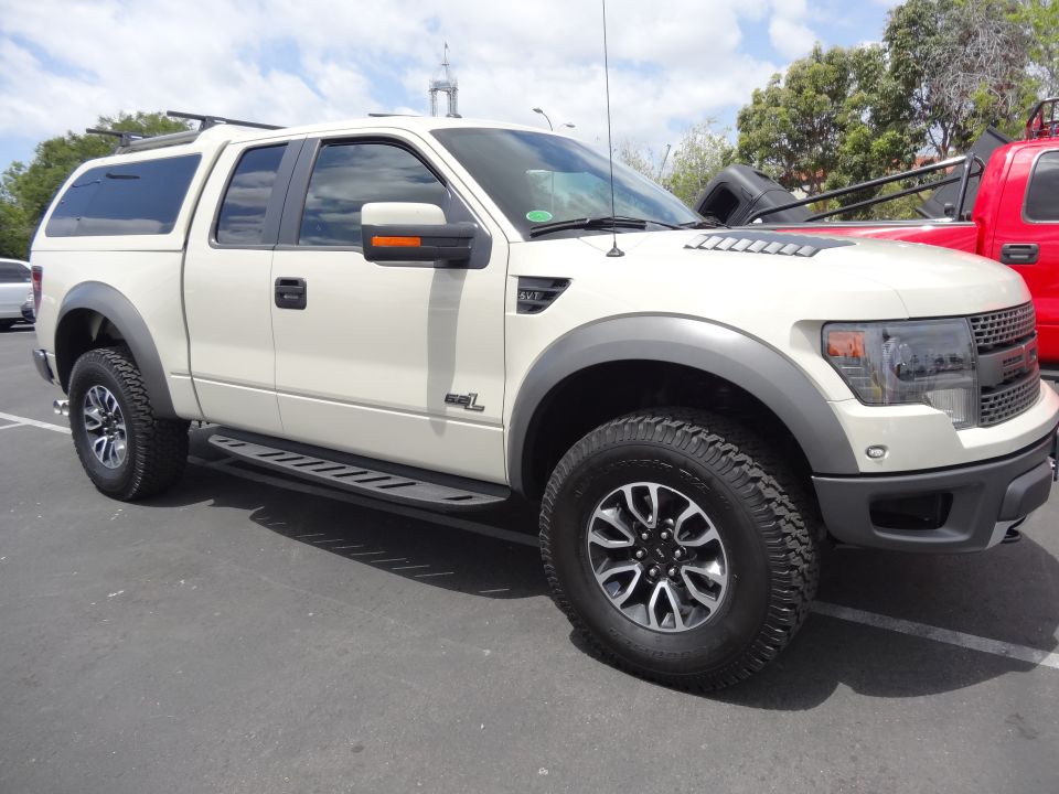 White pickup truck with cap, 3/4 front view