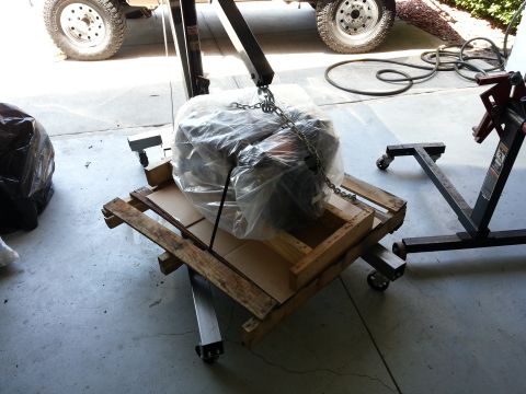 1994 Ford Bronco - An engine is prepared for removal or installation using an engine hoist and stand.