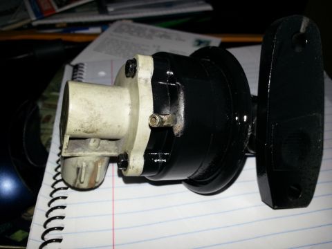 1994 Ford Bronco - Close-up of an automotive electrical connector part, placed on a notepad.