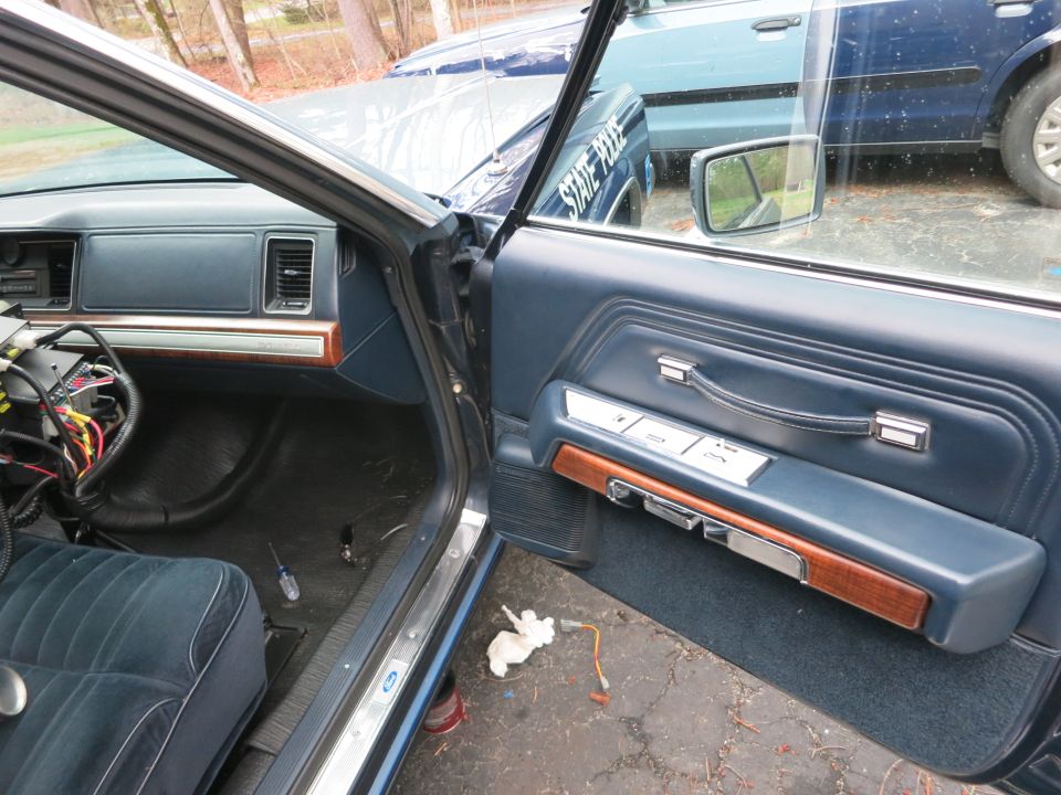 Interior of a 1991 Ford Crown Victoria LTD, showing the driver's side door panel and dashboard