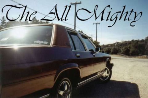 1986 Ford LTD Crown Victoria - This 1986 Ford Crown Victoria LTD is captured in a three-quarter front view under a bright sky.