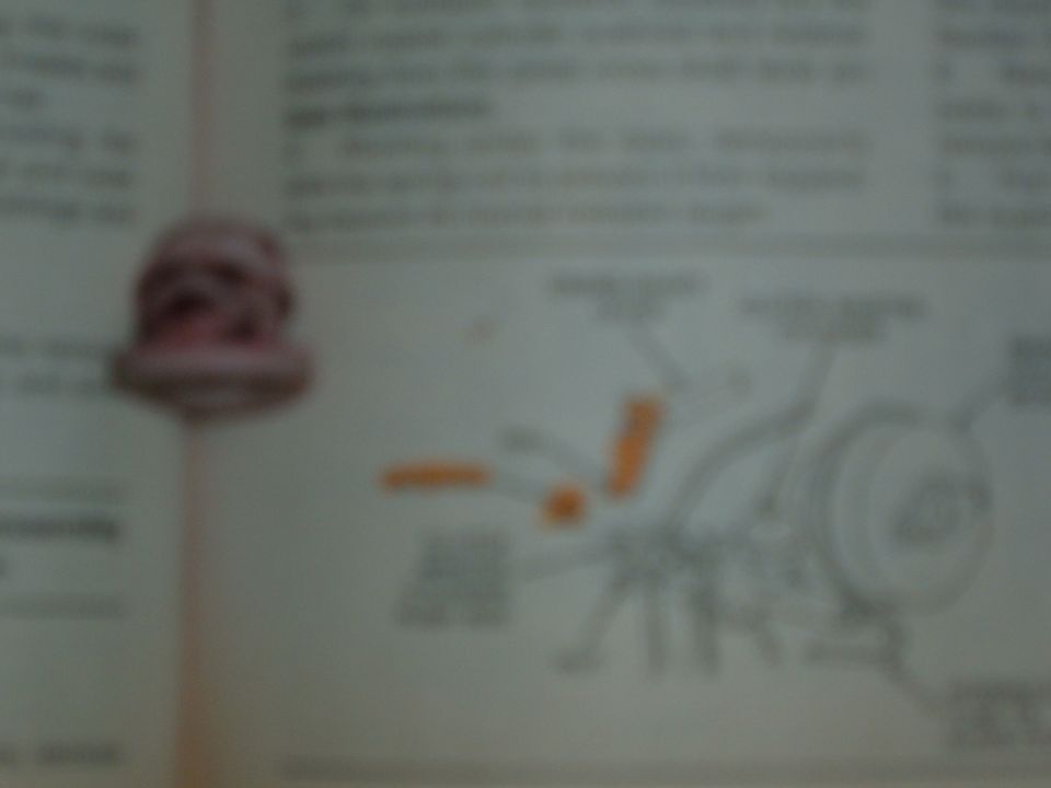 Blurry scanned service manual page with clutch and brake booster figure