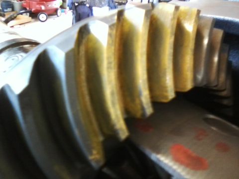 1999 Mercury Grand Marquis - This is a close-up view of a differential gear, showing its teeth and some red markings on the metal plate.