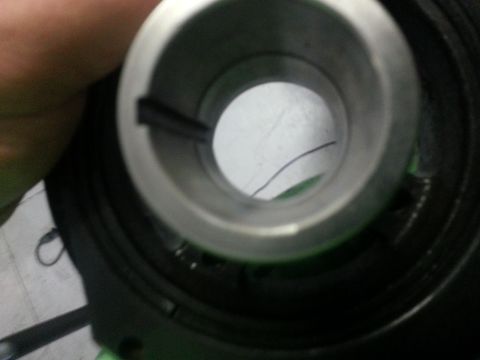 1994 Ford Bronco - A close-up view of a metal engine component, possibly a bearing or seal, showing internal details.