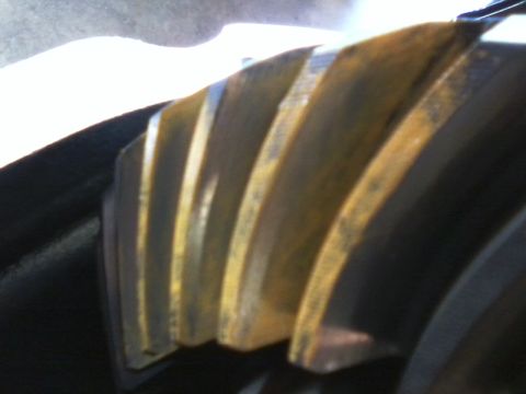 1999 Mercury Grand Marquis - A close-up view of a differential gear, showing signs of rust and wear on its teeth.