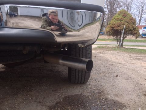 2006 Chevrolet Silverado 2500 - The rear of a 2006 Chevrolet Silverado 2500 is shown, its chrome bumper and exhaust system.