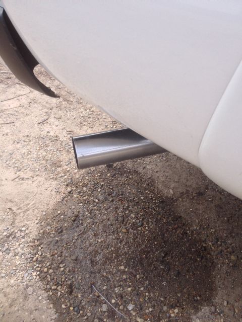 2006 Chevrolet Silverado 2500 - Exhaust pipe on a white vehicle. The album claims it is a 2006 Chevrolet Silverado 2500.