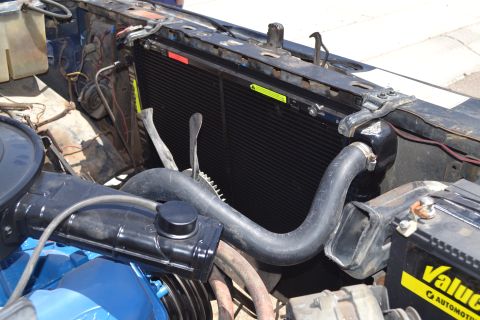 1981 Ford F-250 - Close-up view of a vehicle's radiator and engine compartment, showing hoses and other components.