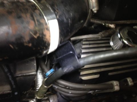 1981 Ford LTD - Picture of the bracket I made to keep the clutch cable away from the header heat. It just clamps to the intake tube but I spent a good amou…