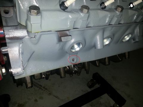 1994 Ford Bronco - Engine block with spark plugs, part of a vehicle's engine.