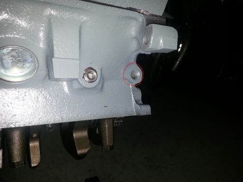 1994 Ford Bronco - A close-up view of an engine block, highlighting a threaded hole and surrounding components.