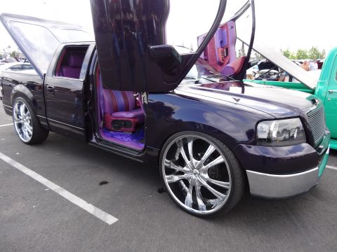 1994 Ford Bronco - This customized 2004 Ford F-150 features striking purple paint, lambo doors, and a vibrant interior.