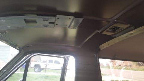 1994 Ford Bronco - Interior of a vehicle, with a white truck seen through the window.