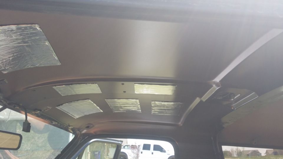 Interior ceiling of a vehicle with soundproofing material applied