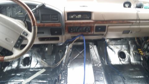 1994 Ford Bronco - The interior of a 1994 Ford Bronco is shown with soundproofing material installed on the floor.