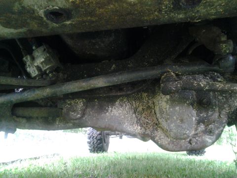 1983 Ford F-250 - The underside of a vehicle, with visible dirt and grime on the suspension components and differential.