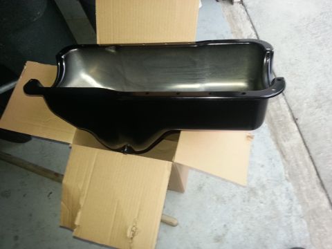 1994 Ford Bronco - A black oil pan is shown, likely for an engine replacement or repair.