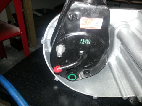 1994 Ford Bronco - Close-up of a power steering pump with manufacturing codes and a 3F sticker visible.