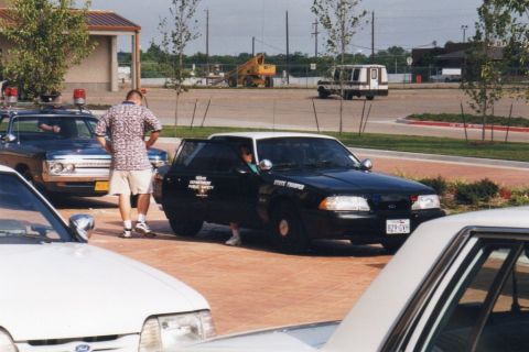 1991 Ford LTD Crown Victoria - A Texas Department of Public Safety vehicle is parked, with its door open.