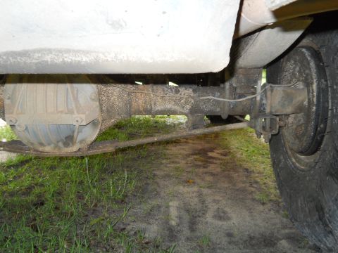 1992 Ford Bronco - Underside view shows the rear axle assembly and leaf springs of a vehicle.