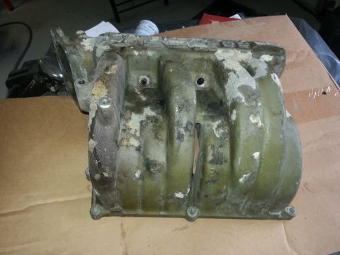 1994 Ford Bronco - This intake manifold shows significant wear and is likely a replacement part.