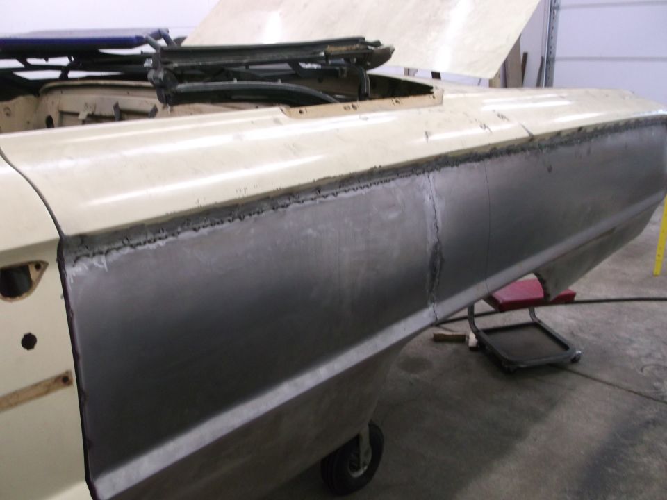 1964 Ford Galaxie side panel repair, showing welded seams