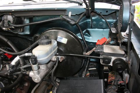 1994 Ford Bronco - Close-up view of the engine bay of a 1994 Ford Bronco, showing brake system components.