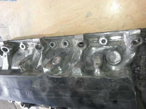1994 Ford Bronco - Engine cylinder head with visible casting marks and part number.