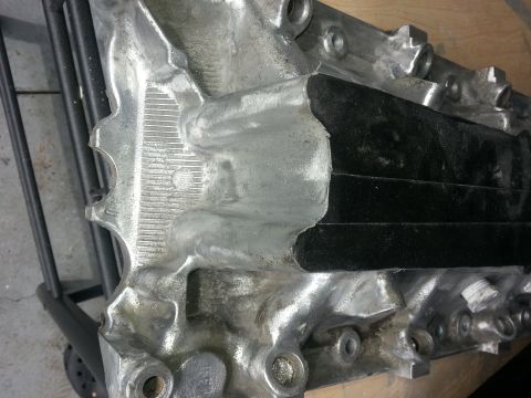 1994 Ford Bronco - This is a close-up view of an engine intake manifold, not a 1994 Ford Bronco.