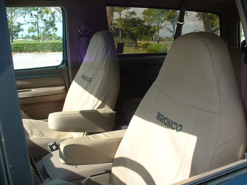 Interior view of tan seat covers with "BRONCO" lettering