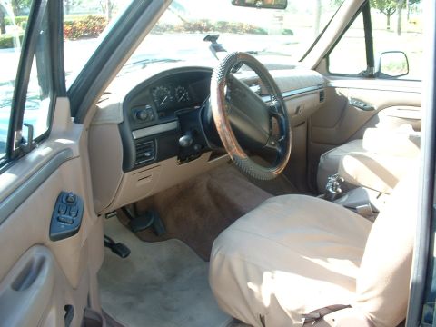 1994 Ford Bronco - Interior view of a 1994 Ford Bronco, highlighting the dashboard and seating area.