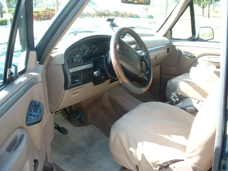 1994 Ford Bronco interior showing dashboard, steering wheel, and seats